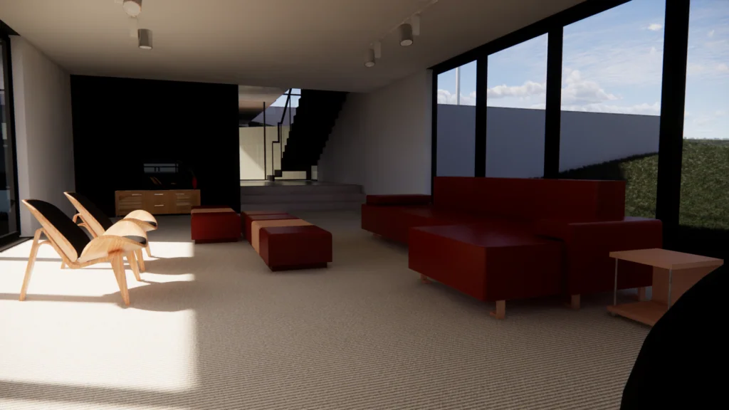 Modern interior space with red sectional seating, wooden lounge chairs, and large windows overlooking landscaped grounds