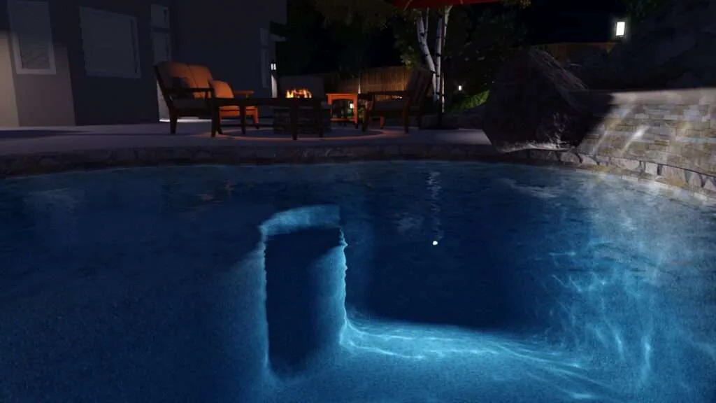 Illuminated swimming pool at night with glowing blue water, underwater structure, and lounge chairs with fire pit in background